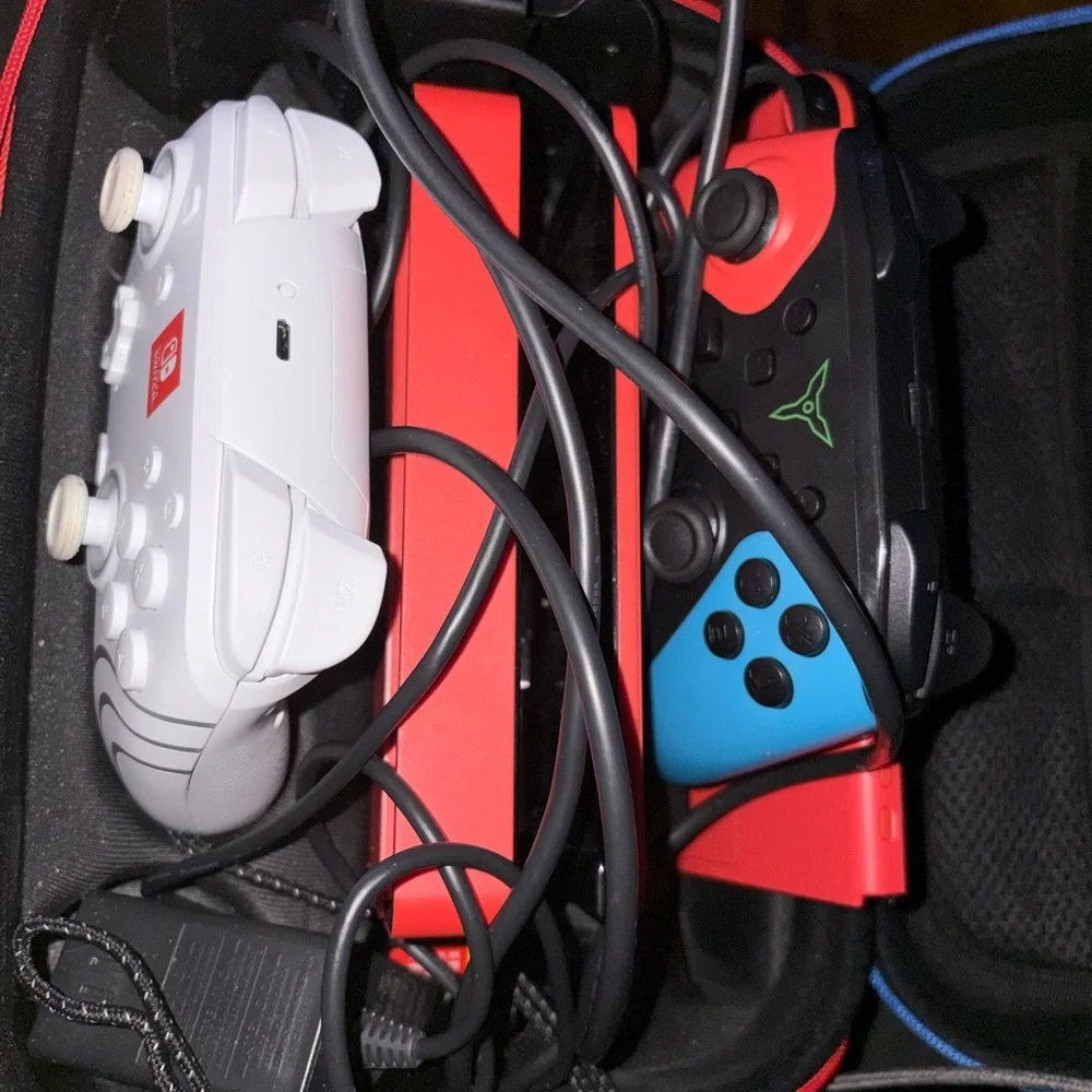 Nintendo Switch 2 wireless controllers, one battery operated controller, case